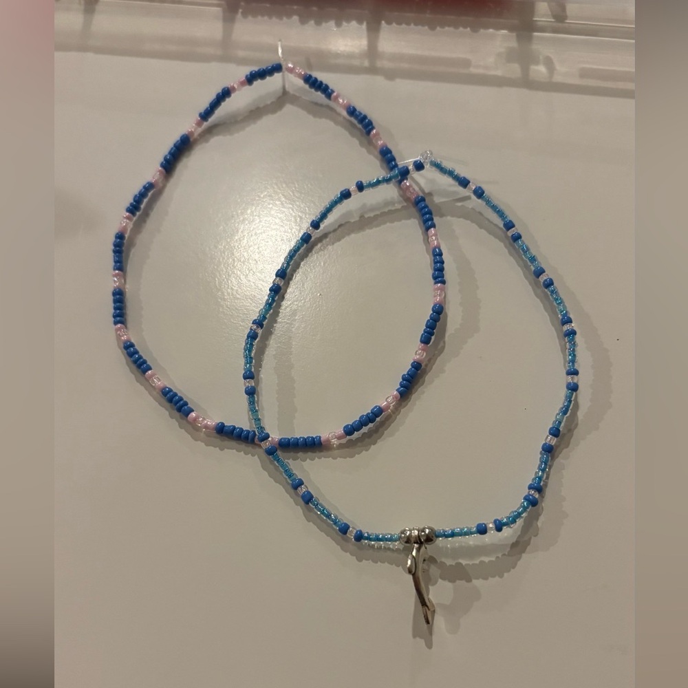 Homemade blue anklets with dolphin charm